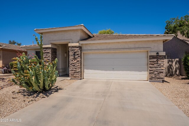 170 E Canary Ct, San Tan Valley, AZ 85143 - view of front of home with stone siding, a garage, stucco siding, and concrete driveway