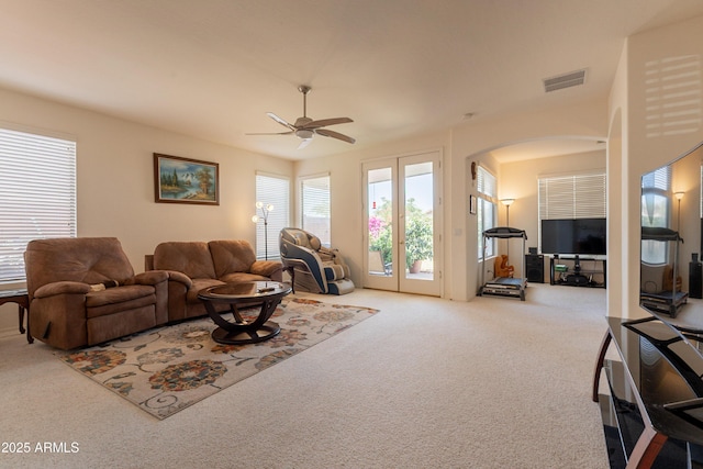 170 E Canary Ct, San Tan Valley, AZ 85143 - carpeted living room with arched walkways and ceiling fan
