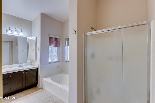 bathroom featuring tile patterned flooring, plus walk in shower, and vanity