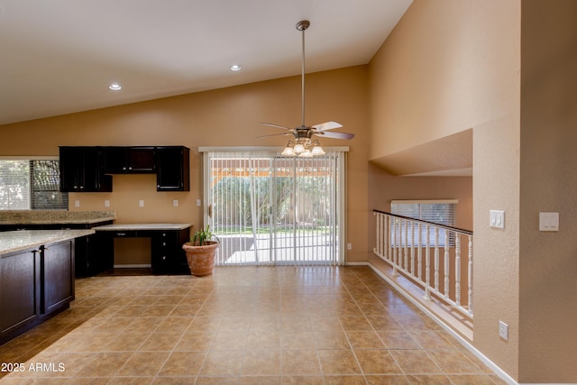 kitchen featuring high vaulted ceiling, ceiling fan, and light tile patterned floors