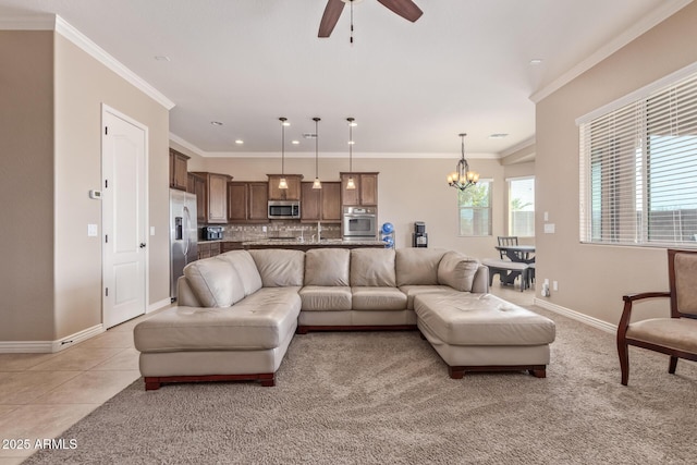 living room featuring crown molding, light tile patterned floors, baseboards, and a wealth of natural light