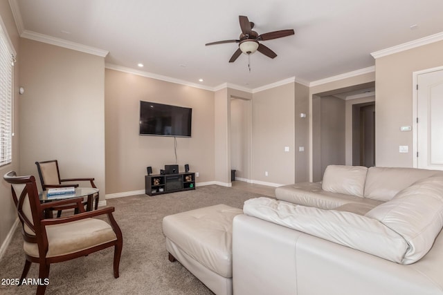 carpeted living area featuring crown molding, a ceiling fan, and baseboards