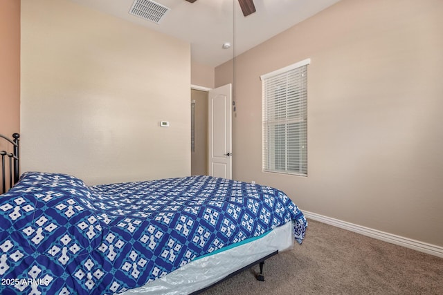 carpeted bedroom featuring visible vents, baseboards, and a ceiling fan