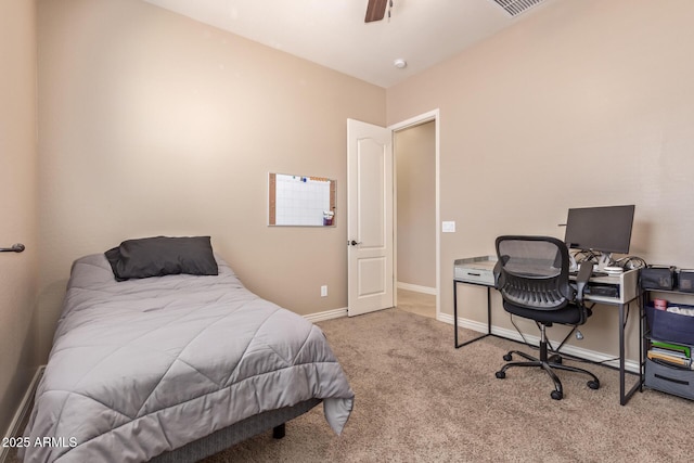 bedroom with baseboards, a ceiling fan, and carpet flooring