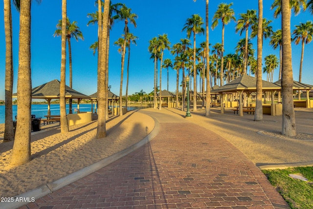 surrounding community with a gazebo and a water view