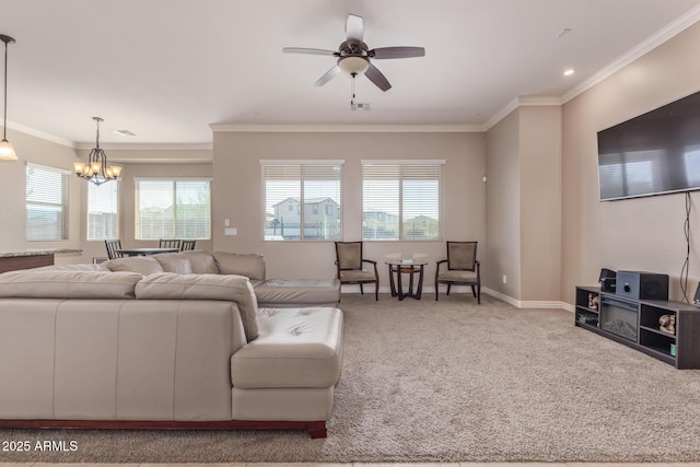 living area featuring carpet, a healthy amount of sunlight, and ornamental molding