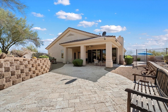 34611 N Sunset Trl, Cave Creek, AZ 85331 - rear view of house with a patio area, a ceiling fan, stucco siding, and a chimney