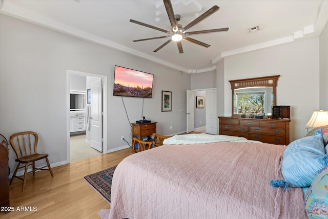 34611 N Sunset Trl, Cave Creek, AZ 85331 - bedroom with light wood-style flooring, ornamental molding, a ceiling fan, baseboards, and ensuite bath