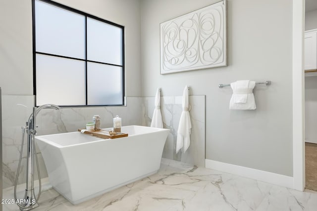 bathroom with a bathing tub and sink