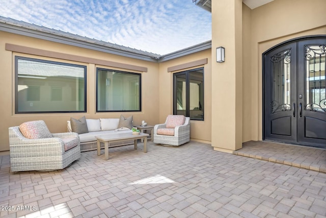 view of patio / terrace with an outdoor hangout area and french doors