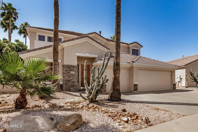 13599 W Monte Vista Rd, Goodyear, AZ 85395 - view of front of property featuring stucco siding, an attached garage, driveway, and a tiled roof