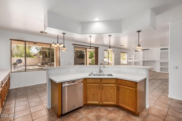 13599 W Monte Vista Rd, Goodyear, AZ 85395 - kitchen with stainless steel dishwasher, a sink, healthy amount of natural light, and light tile patterned floors