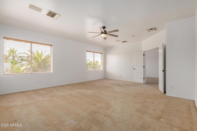 13599 W Monte Vista Rd, Goodyear, AZ 85395 - spare room featuring ceiling fan, light colored carpet, and baseboards