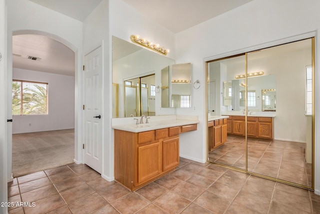 13599 W Monte Vista Rd, Goodyear, AZ 85395 - bathroom with two vanities and tile patterned flooring