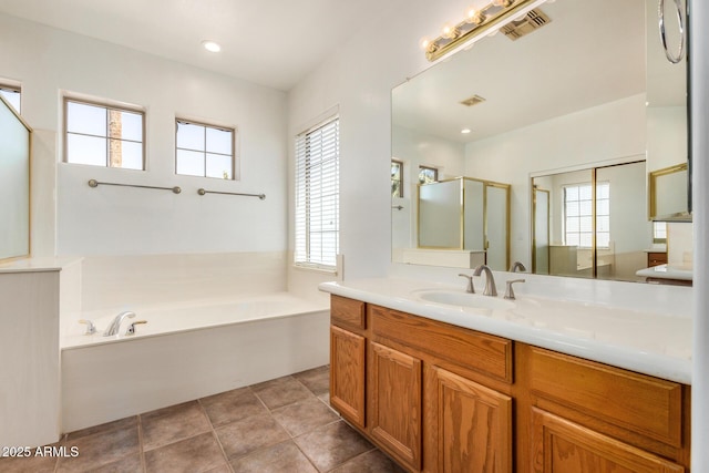 13599 W Monte Vista Rd, Goodyear, AZ 85395 - bathroom featuring a garden tub, vanity, and a shower stall