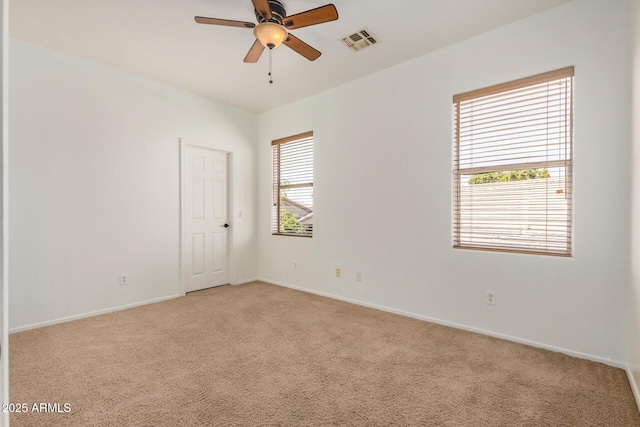 13599 W Monte Vista Rd, Goodyear, AZ 85395 - unfurnished room with a ceiling fan, light colored carpet, and baseboards