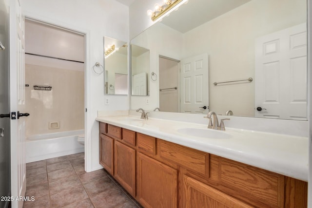 13599 W Monte Vista Rd, Goodyear, AZ 85395 - bathroom featuring double vanity, toilet, shower / washtub combination, and tile patterned flooring