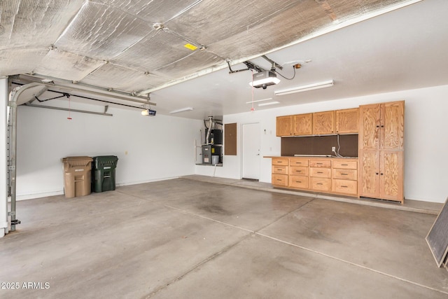 13599 W Monte Vista Rd, Goodyear, AZ 85395 - garage with heating unit and a garage door opener