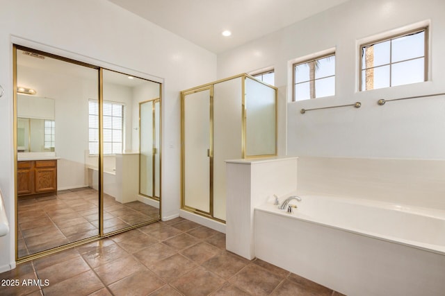 13599 W Monte Vista Rd, Goodyear, AZ 85395 - full bathroom with a bath, vanity, a stall shower, and recessed lighting