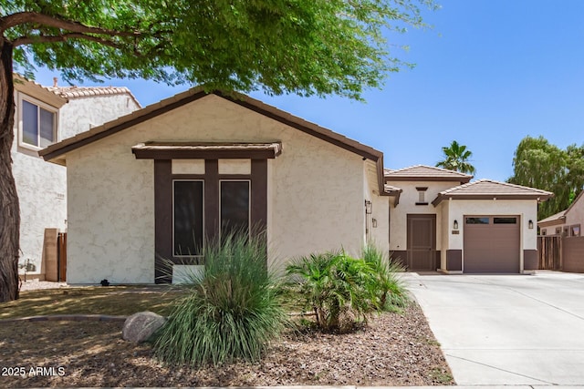 6805 S Sapphire Way, Chandler, AZ 85249 - view of front of property with a garage, concrete driveway, stucco siding, and a tiled roof