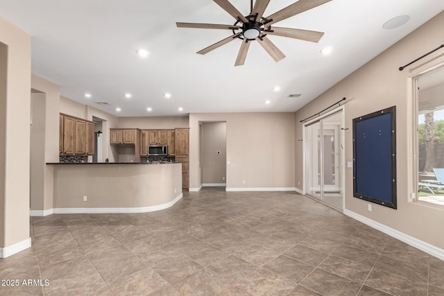 6805 S Sapphire Way, Chandler, AZ 85249 - unfurnished living room with a ceiling fan, recessed lighting, and baseboards