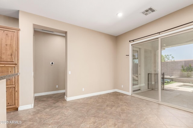 6805 S Sapphire Way, Chandler, AZ 85249 - unfurnished room with baseboards and recessed lighting