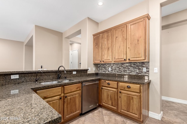 6805 S Sapphire Way, Chandler, AZ 85249 - kitchen with a sink, dishwasher, dark stone countertops, and backsplash