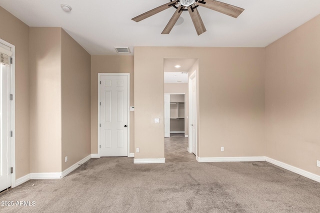 6805 S Sapphire Way, Chandler, AZ 85249 - unfurnished bedroom featuring carpet, baseboards, a walk in closet, and ceiling fan