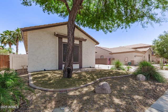 6805 S Sapphire Way, Chandler, AZ 85249 - view of front of home featuring fence, stucco siding, and an attached garage