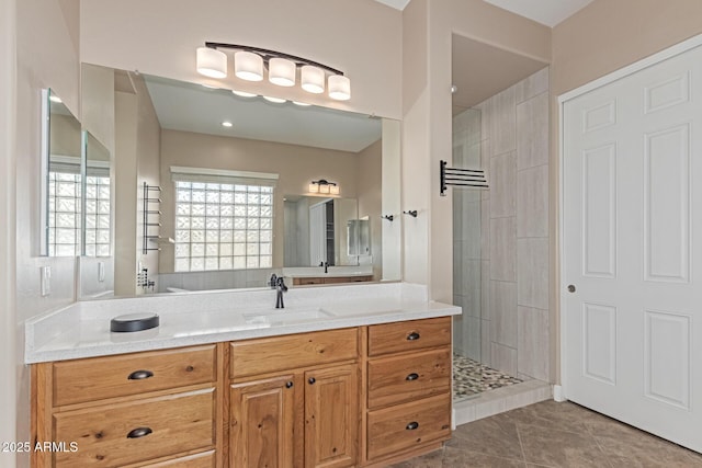 6805 S Sapphire Way, Chandler, AZ 85249 - bathroom with a tile shower, vanity, and tile patterned floors