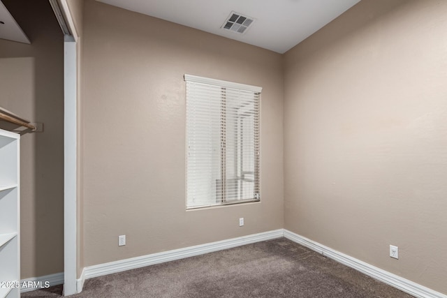 6805 S Sapphire Way, Chandler, AZ 85249 - spare room featuring dark colored carpet and baseboards