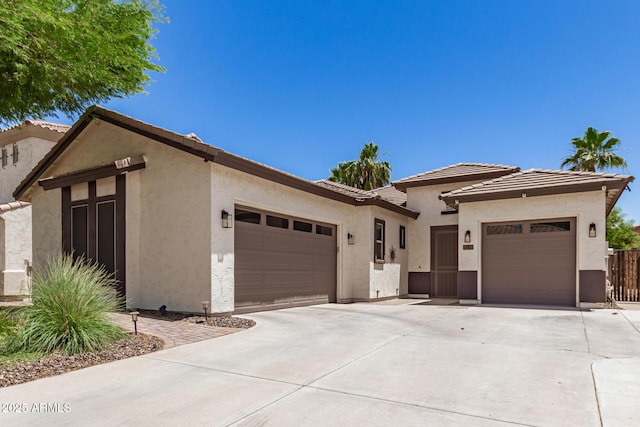 6805 S Sapphire Way, Chandler, AZ 85249 - view of front of property featuring a garage, driveway, and stucco siding