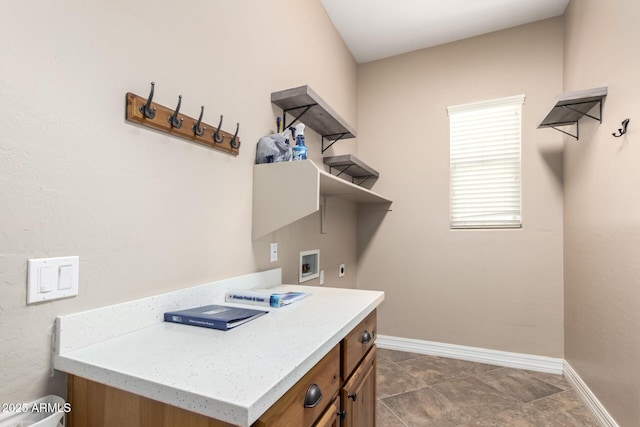 6805 S Sapphire Way, Chandler, AZ 85249 - clothes washing area featuring hookup for an electric dryer, washer hookup, baseboards, and cabinet space