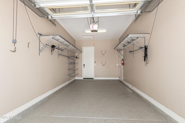 6805 S Sapphire Way, Chandler, AZ 85249 - garage with a garage door opener and baseboards