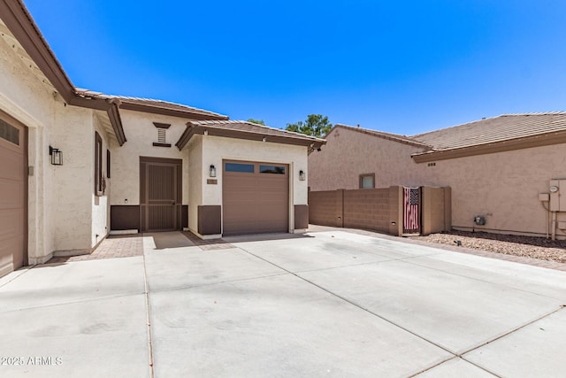 6805 S Sapphire Way, Chandler, AZ 85249 - view of home's exterior with driveway, stucco siding, a garage, and a tiled roof