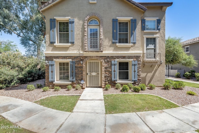 5734 S 21st Pl, Phoenix, AZ 85040 - view of front of property with stucco siding and a front lawn