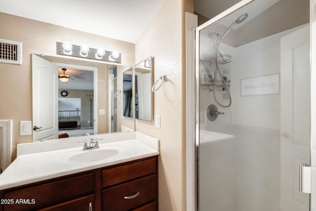 5734 S 21st Pl, Phoenix, AZ 85040 - bathroom with a stall shower, vanity, a textured wall, and ceiling fan