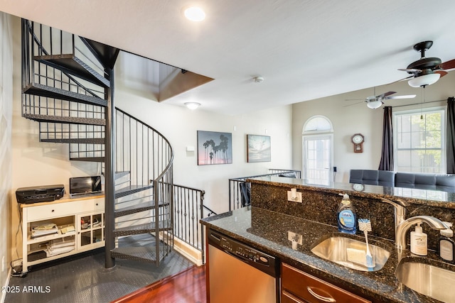5734 S 21st Pl, Phoenix, AZ 85040 - kitchen featuring dishwasher, dark stone counters, ceiling fan, and dark wood-style flooring