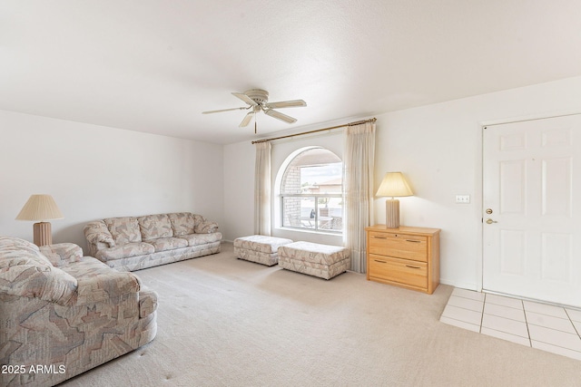 living room with light carpet and a ceiling fan