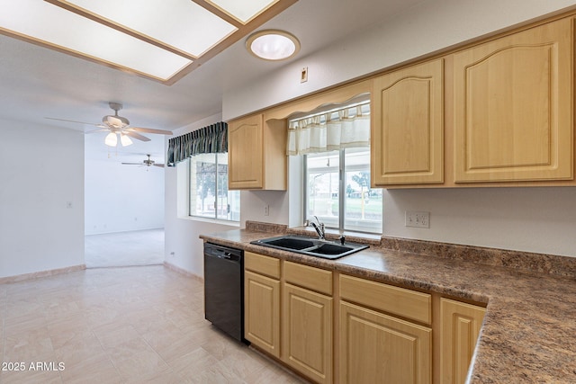 kitchen featuring baseboards, light brown cabinetry, a sink, dishwasher, and dark countertops