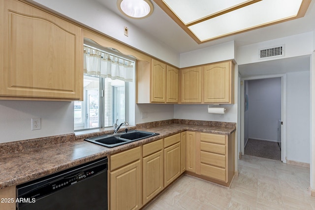 kitchen with visible vents, light brown cabinetry, a sink, black dishwasher, and dark countertops