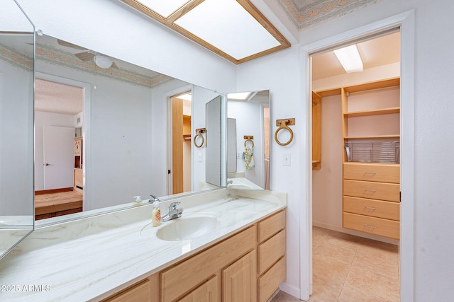 bathroom featuring vanity and tile patterned flooring