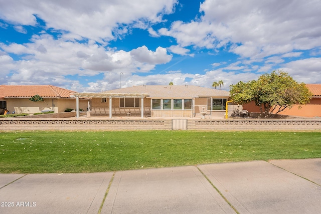 ranch-style house featuring a patio, a front lawn, and a pergola