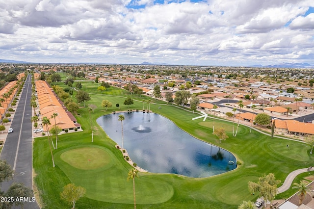 aerial view with a residential view, a water view, and view of golf course