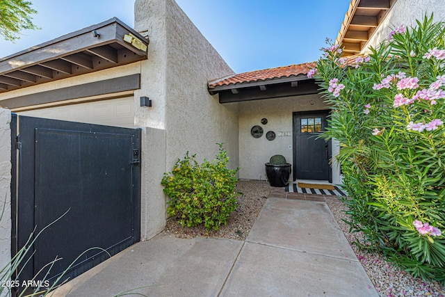 7821 N Via De La Sombre, Scottsdale, AZ 85258 - entrance to property with stucco siding, a tile roof, and a gate