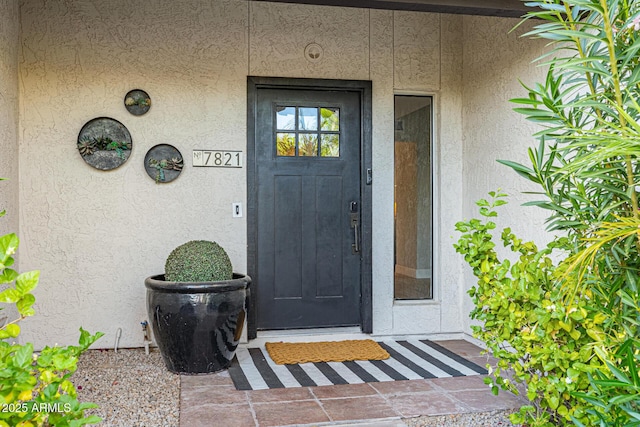 7821 N Via De La Sombre, Scottsdale, AZ 85258 - view of exterior entry featuring stucco siding