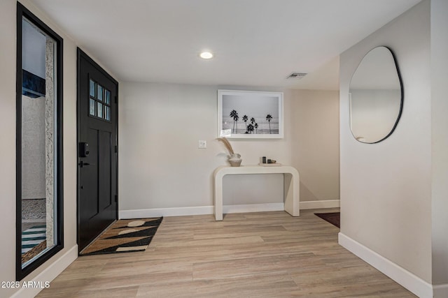 7821 N Via De La Sombre, Scottsdale, AZ 85258 - entryway with baseboards, light wood finished floors, and recessed lighting