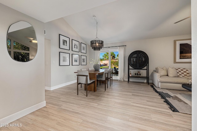 7821 N Via De La Sombre, Scottsdale, AZ 85258 - dining space featuring a ceiling fan, baseboards, vaulted ceiling, light wood-style floors, and a chandelier