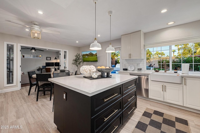 7821 N Via De La Sombre, Scottsdale, AZ 85258 - kitchen with dishwasher, a sink, white cabinetry, a ceiling fan, and recessed lighting