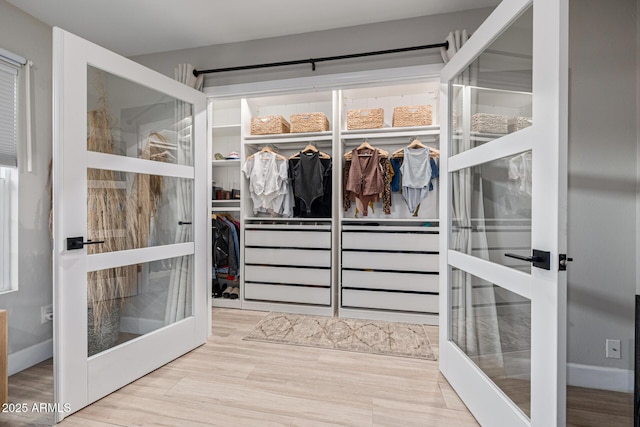 7821 N Via De La Sombre, Scottsdale, AZ 85258 - spacious closet with french doors and wood finished floors